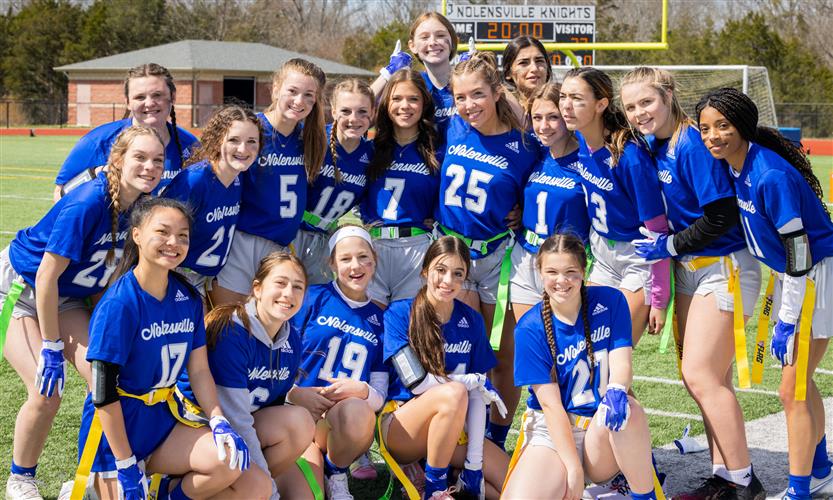 Girls play flag football